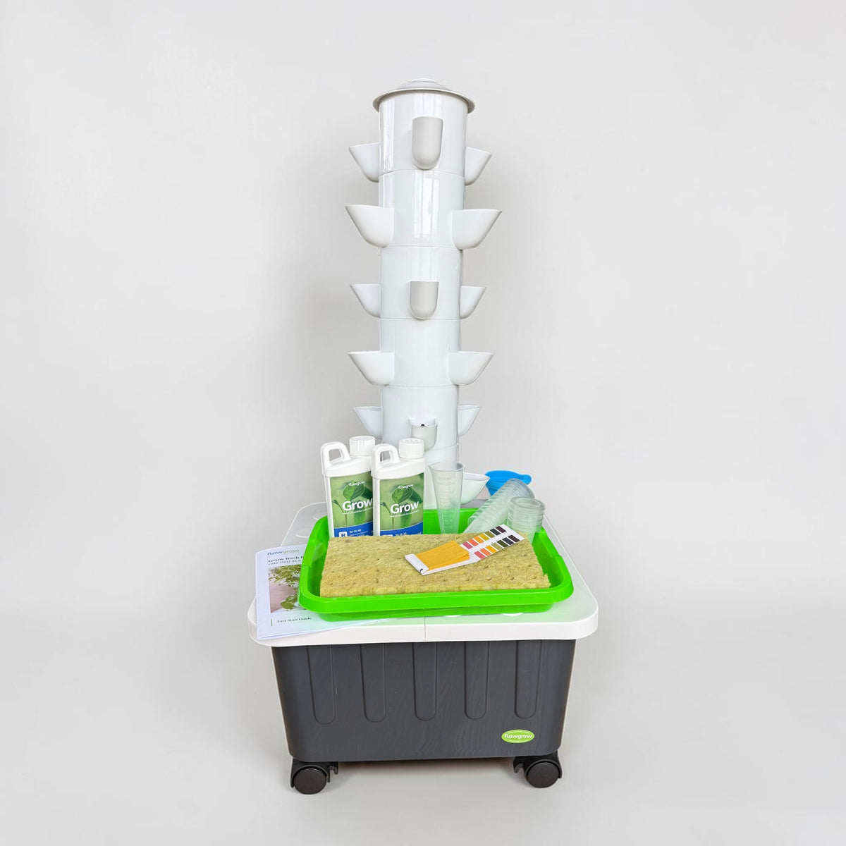 FlowGrow 6 Layer Hydroponic Tower with Starter Kit including Grow nutrients, rockwool cubes, net pots, pH test strips and seed starting essentials.