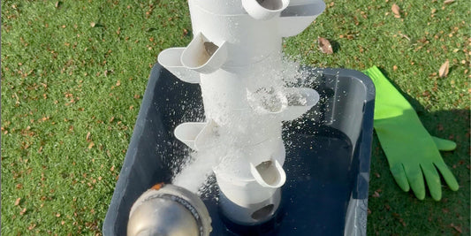 Rinsing FlowGrow hydroponic tower stacks during cleaning