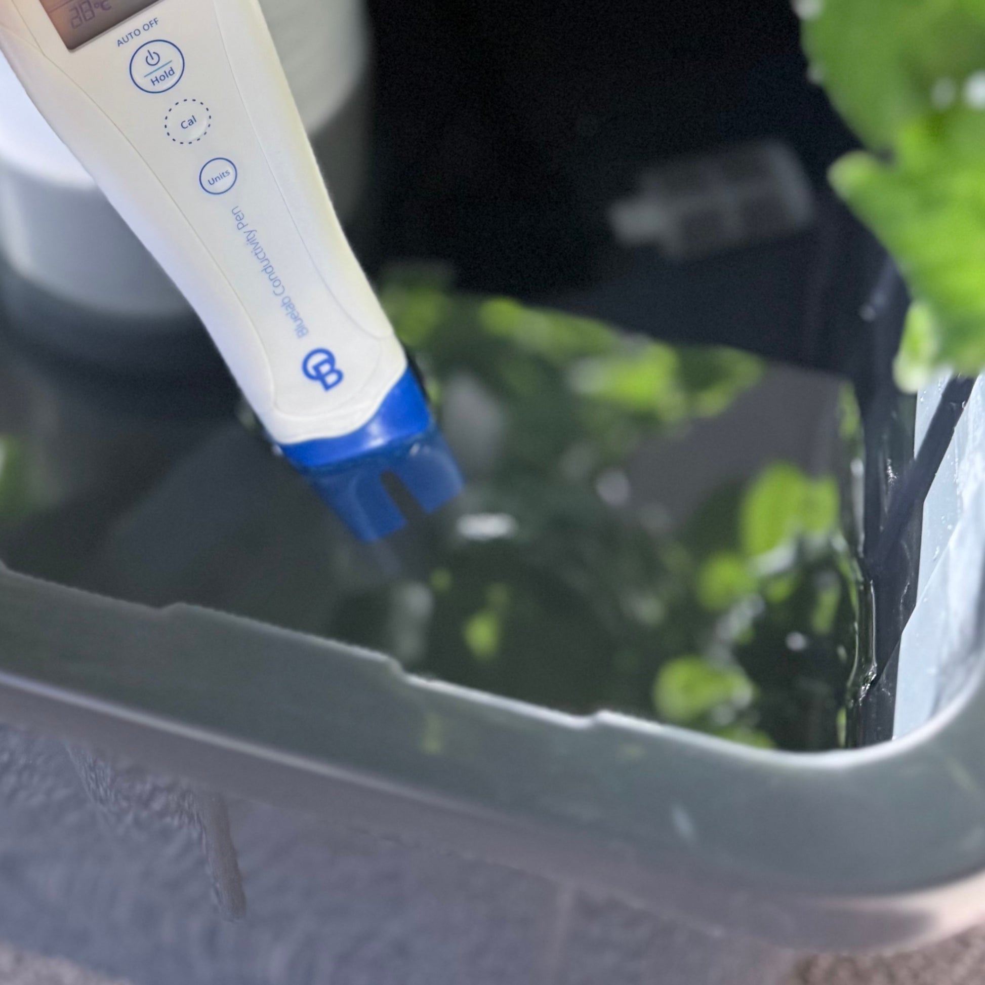 Bluelab Conductivity Pen measuring nutrient water in a FlowGrow tower