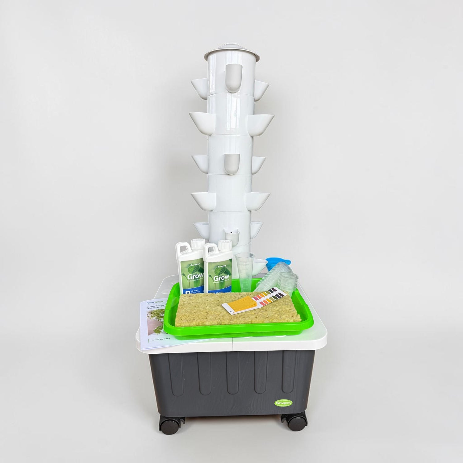 FlowGrow 6 Layer Hydroponic Tower with Starter Kit including Grow nutrients, rockwool cubes, net pots, pH test strips and seed starting essentials.