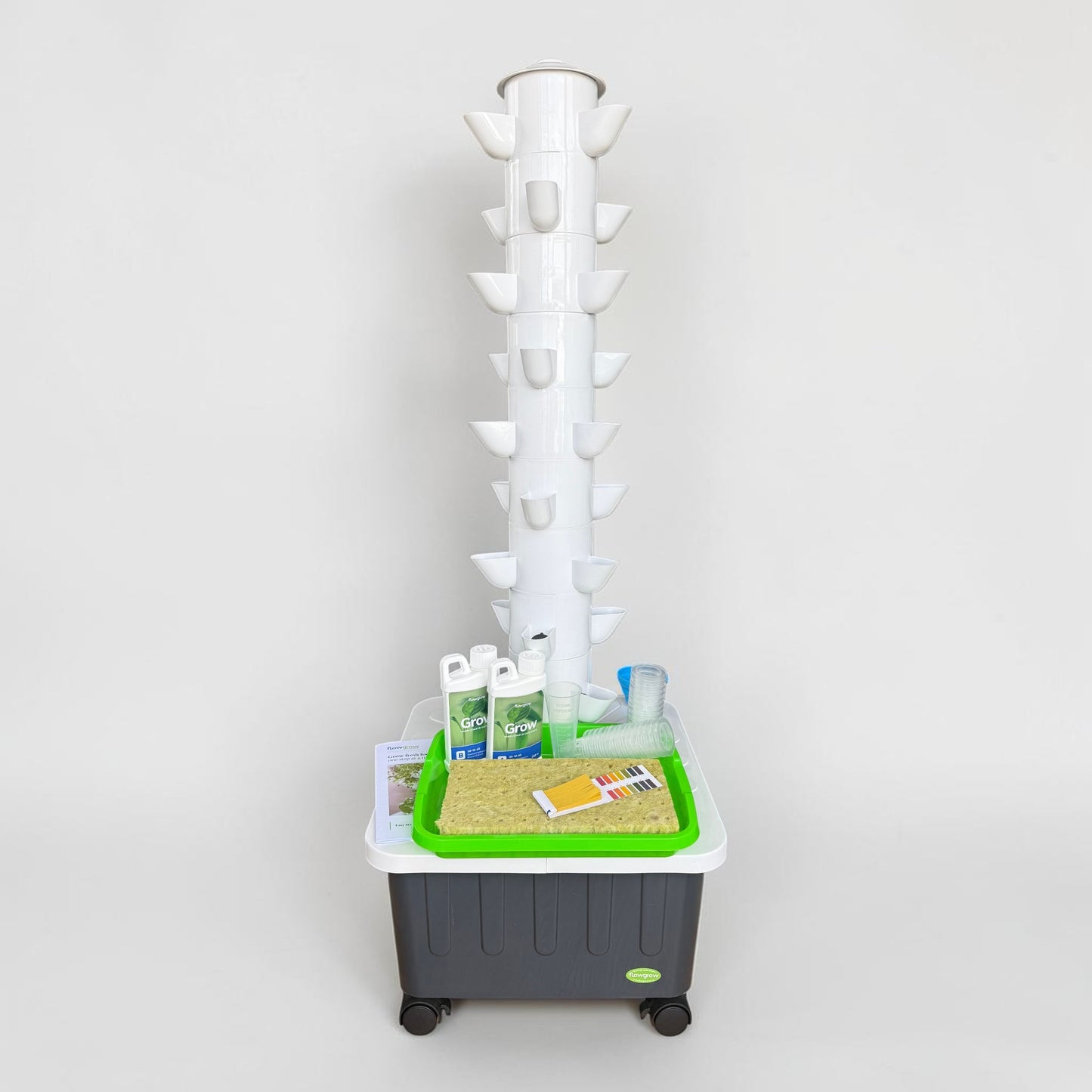 FlowGrow 9 Layer Hydroponic Tower with Starter Kit including Grow nutrients, rockwool cubes, net pots, pH test strips and seed starting essentials.