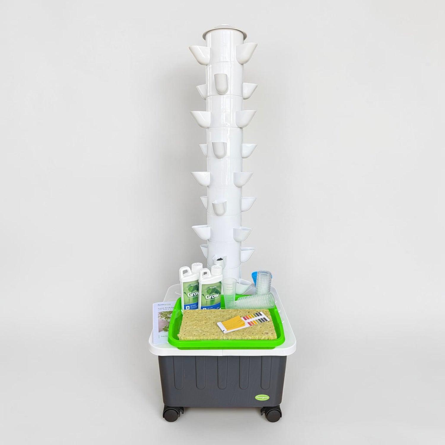 FlowGrow 9 Layer Hydroponic Tower with Starter Kit including Grow nutrients, rockwool cubes, net pots, pH test strips and seed starting essentials.