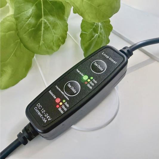 FlowGrow timer connected to a hydroponic tower pump system