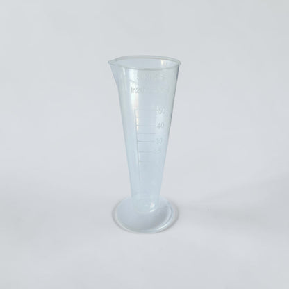 Clear 50 mL measuring cup for mixing FlowGrow hydroponic nutrients